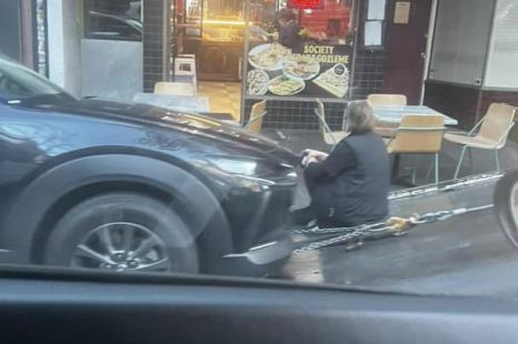 Driver sits in front of their car for 2 hours to prevent it from being towed from clear way